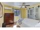 Cozy bedroom with hardwood floors, natural light, and closet with sliding doors and built-in shelves at 20101 Spring Gulch Rd, Morrison, CO 80465