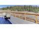 Home features a deck with open railing offering beautiful wooded views for peaceful outdoor enjoyment at 20101 Spring Gulch Rd, Morrison, CO 80465