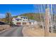 Two story home with a three car garage situated on a large lot with mature trees and mountain views at 20101 Spring Gulch Rd, Morrison, CO 80465