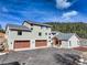 Modern, two-story home featuring a three-car garage and beautiful architecture at 20101 Spring Gulch Rd, Morrison, CO 80465