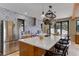 Kitchen with large island, stainless steel appliances, and backyard access at 20101 Spring Gulch Rd, Morrison, CO 80465