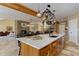 Bright open kitchen with center island, stone fireplace, and dining area for entertaining Gathering and friends at 20101 Spring Gulch Rd, Morrison, CO 80465