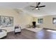 Bright and spacious living room features hardwood floors, high ceilings, and natural light at 20101 Spring Gulch Rd, Morrison, CO 80465