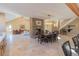 Open floor plan with stone fireplace, dining table and view of the living room at 20101 Spring Gulch Rd, Morrison, CO 80465