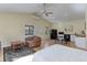 Cozy living space with kitchenette, hardwood floors, ceiling fan, and ample natural light at 20101 Spring Gulch Rd, Morrison, CO 80465