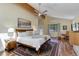 Sunlit main bedroom featuring a vaulted ceiling with beam and ceiling fan and an area rug at 20101 Spring Gulch Rd, Morrison, CO 80465