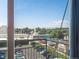 A sunny balcony view shows parking, local shops and mountain views creating a great outdoor space at 277 N Broadway # 403, Denver, CO 80203