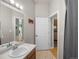 Bright bathroom featuring vanity with a mirror, tile floors, and access to the closet at 277 N Broadway # 403, Denver, CO 80203