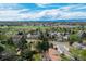 Scenic aerial view of the neighborhood showcasing lush green spaces and mountain views at 6302 S Ivy Ct, Centennial, CO 80111