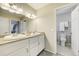 Spacious bathroom offers double sinks, large mirror, and stylish lighting over a marble countertop at 6302 S Ivy Ct, Centennial, CO 80111