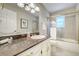 Well-lit bathroom featuring granite countertops, and modern fixtures for a relaxing and functional space at 6302 S Ivy Ct, Centennial, CO 80111