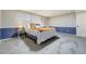 Bedroom with plush carpet, a comfortable queen-sized bed with stylish lamps on side tables and an accent wall at 6302 S Ivy Ct, Centennial, CO 80111