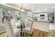 Bright dining area adjacent to the kitchen features modern light fixture, with great natural light at 6302 S Ivy Ct, Centennial, CO 80111