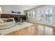 The living room is cozy, and it features hardwood floors, fireplace, and decorative glass panel doors at 6302 S Ivy Ct, Centennial, CO 80111