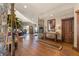 Open concept foyer features wood floors and views of dining and sitting area for entertainment at 142 Outpost Ln, Evergreen, CO 80439
