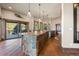 Open kitchen featuring a spacious island, wood floors, natural light and outdoor access at 142 Outpost Ln, Evergreen, CO 80439