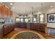 Open kitchen featuring wooden cabinets, granite countertops and stainless steel appliances at 142 Outpost Ln, Evergreen, CO 80439