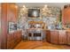 Kitchen with stone accent wall and high-end appliances at 142 Outpost Ln, Evergreen, CO 80439