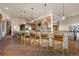 Gourmet kitchen bar featuring stone accents, pendant lighting, and ample seating perfect for entertaining at 142 Outpost Ln, Evergreen, CO 80439