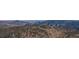 Stunning mountain view with rolling hills and expansive evergreen coverage in a natural landscape at 142 Outpost Ln, Evergreen, CO 80439