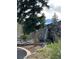 Stone bridge waterfall feature with lush greenery, mature trees, and natural rock landscaping adding a touch of nature at 142 Outpost Ln, Evergreen, CO 80439