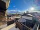 Balcony with metal railing overlooking the street, gazebo, and other homes at 7345 E Hinsdale Pl, Centennial, CO 80112