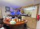 Finished basement with custom curved wet bar, mirror, and neon accents at 7345 E Hinsdale Pl, Centennial, CO 80112