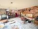 Eclectic basement space featuring stone and wood paneled walls, and red stairs at 7345 E Hinsdale Pl, Centennial, CO 80112