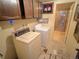 Cozy laundry room featuring a washer, dryer, and cabinet storage at 7345 E Hinsdale Pl, Centennial, CO 80112