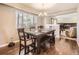 Bright dining room featuring hardwood floors and a large window providing lots of natural light at 7388 S Lafayette W Cir, Centennial, CO 80122