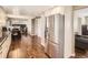 Stainless steel refrigerator in an open concept home design at 7388 S Lafayette W Cir, Centennial, CO 80122