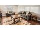 Comfortable living room featuring hardwood floors, neutral color palette, and abundant natural light at 7388 S Lafayette W Cir, Centennial, CO 80122