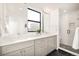 Modern bathroom with double vanity and walk-in shower at 273 S Jackson St, Denver, CO 80209