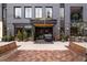 Stylish building entrance with a brick facade and benches at 273 S Jackson St, Denver, CO 80209