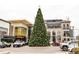 Large Christmas tree in front of upscale shops and restaurants at 273 S Jackson St, Denver, CO 80209