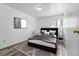 Cozy bedroom with modern decor and a comfortable bed with elegant gray throw blanket at 5995 W Hampden Ave # 3I, Denver, CO 80227