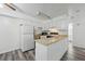 Bright kitchen with white cabinetry, modern appliances, and wood countertops at 5995 W Hampden Ave # 3I, Denver, CO 80227