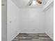 A room with wood-style flooring, white walls, ceiling fan and electrical outlets at 5995 W Hampden Ave # 3I, Denver, CO 80227