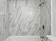 Close up of a shower featuring elegant tile work, modern fixtures, and a clean design at 5995 W Hampden Ave # 3I, Denver, CO 80227