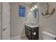 Upgraded bathroom with granite countertop, custom vanity and nautical decor at 24806 E Calhoun Pl # A, Aurora, CO 80016