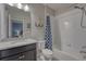 Bathroom with shower-tub combination, anchor decor, granite vanity, and blue accent curtain at 24806 E Calhoun Pl # A, Aurora, CO 80016