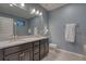 Stylish bathroom with double sinks, granite countertops, and ample cabinet space at 24806 E Calhoun Pl # A, Aurora, CO 80016