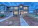 Attractive townhome showcases stone and siding exterior, plus manicured landscaping at 24806 E Calhoun Pl # A, Aurora, CO 80016