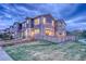 A beautiful townhome featuring a fenced backyard and lush green lawn at 24806 E Calhoun Pl # A, Aurora, CO 80016