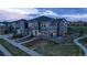 Aerial view of the townhome community featuring manicured lawns and back patios at 24806 E Calhoun Pl # A, Aurora, CO 80016