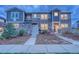 Beautiful two-story townhome with stone accents, landscaping, and welcoming front entrance at 24806 E Calhoun Pl # A, Aurora, CO 80016