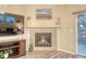 Living room featuring a cozy fireplace and views of the outdoor patio at 24806 E Calhoun Pl # A, Aurora, CO 80016