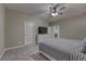 A neutral tone main bedroom with a large bed, an ensuite bath, and ample natural light at 24806 E Calhoun Pl # A, Aurora, CO 80016