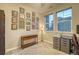 Bright office space with two windows, neutral walls, and decorative national parks art at 24806 E Calhoun Pl # A, Aurora, CO 80016