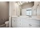 Double vanity bathroom with white cabinets and quartz countertop at 6860 Merseyside Ln, Castle Pines, CO 80108